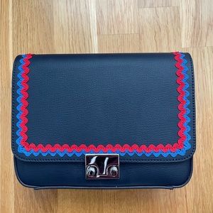 Loeffler Randall leather purse navy blue with red and blue rickrack